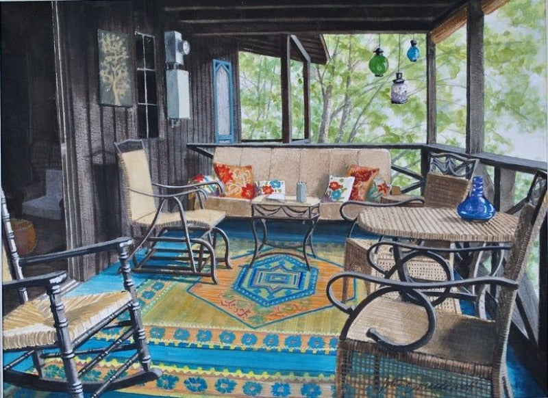 Idle Time-Oral Lake, WV- Limited Edition Giclee Print.  Can Contemporary Realism be Rustic? Why not? From the original watercolor painting by Lotus MacDowell, Artworks WV, of the front porch of a cabin captures the cozy feeling that comes from being in the woods. From the rocking chair in the foreground to the colorful rugs and woven furniture, this outdoor hideaway looks like the perfect place to kick back
